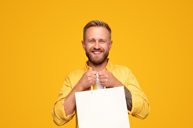 Friendly bearded man during shopping