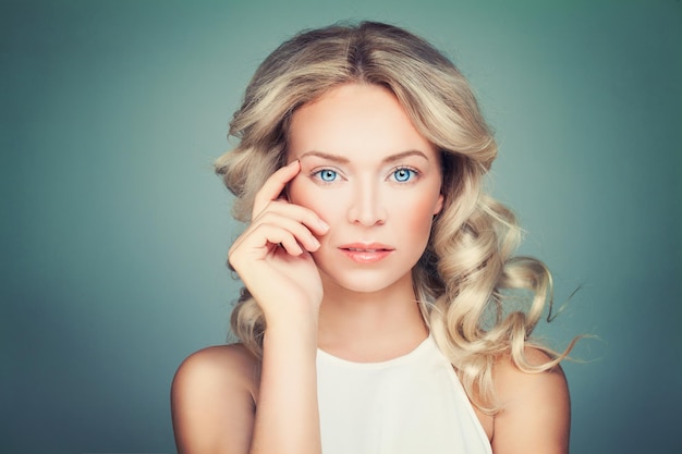 Friendly Blonde Woman Fashion Model with Curly Hair and Natural Makeup