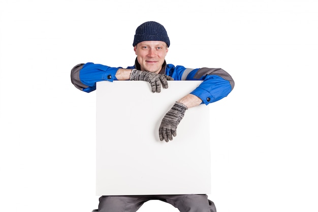 Photo friendly construction worker holding a blank, white sign. isolated on white