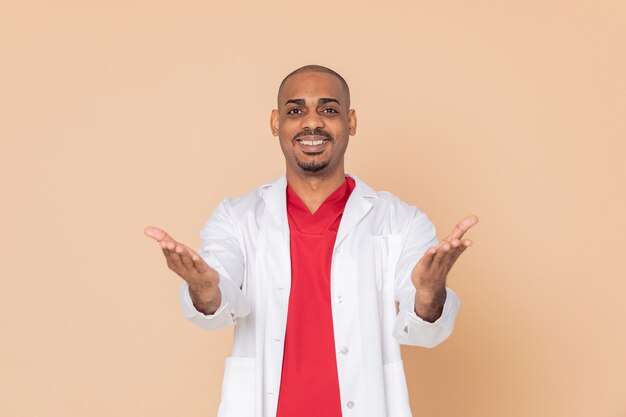 Friendly doctor wearing red uniform