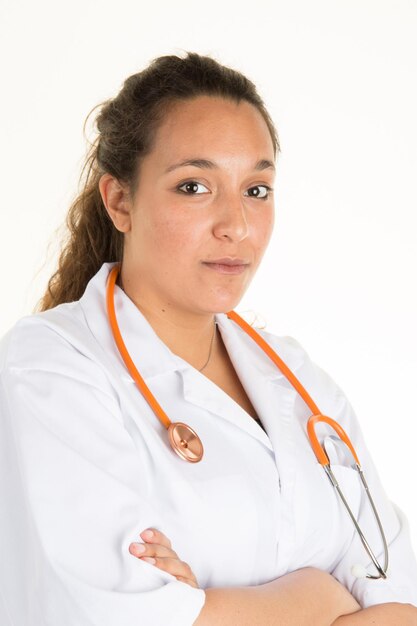 Friendly female doctor smiling - isolated over  white background