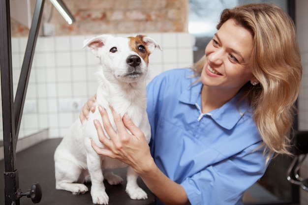 A friendly female veterinarian working at her clinic