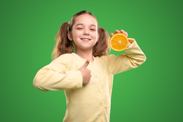 Friendly girl smiling and approving citrus