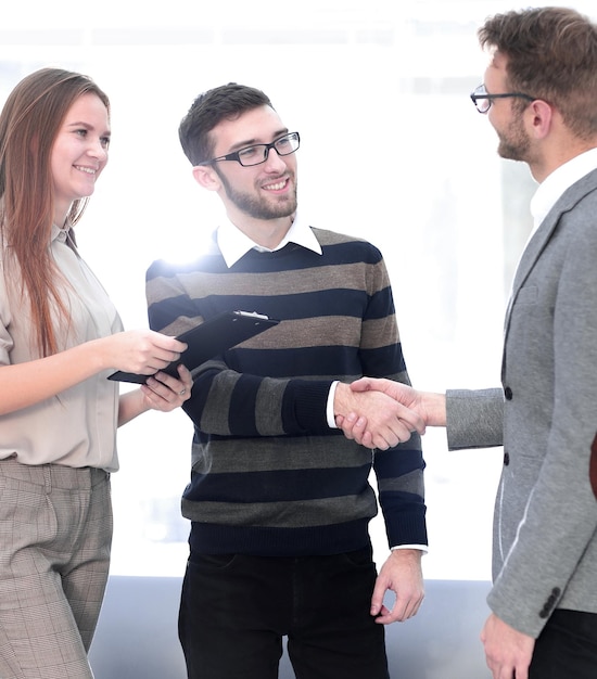 Friendly handshake between colleagues