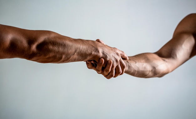 Friendly handshake friends greeting teamwork friendship Rescue helping gesture or hands Two