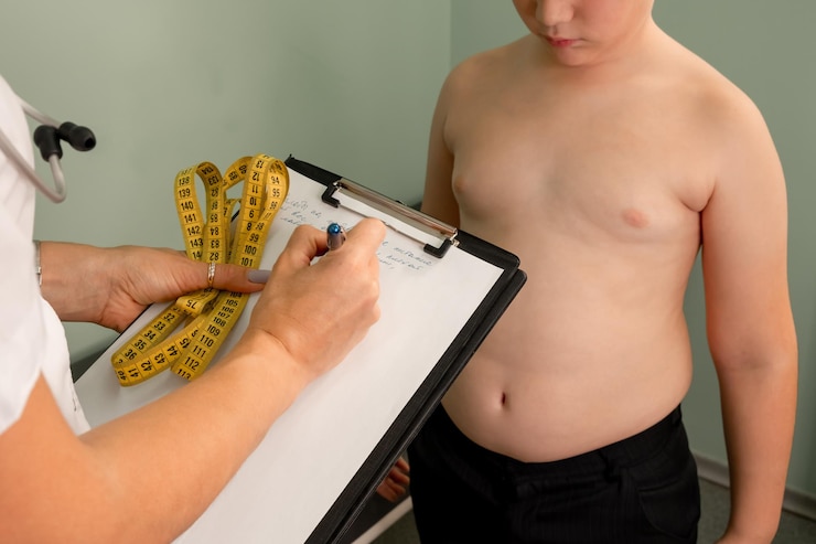 Friendly nutritionist measures waist childhood obesity weight loss