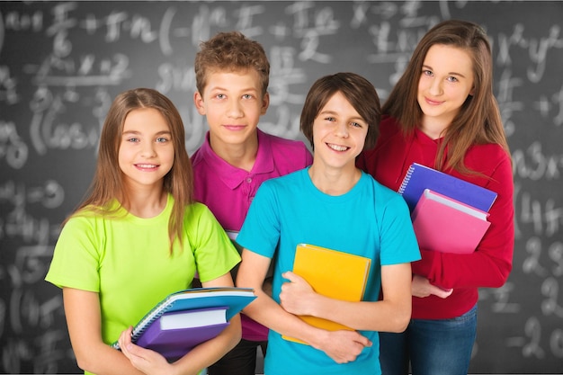 Friendly school children with backpacks concept - isolated on white