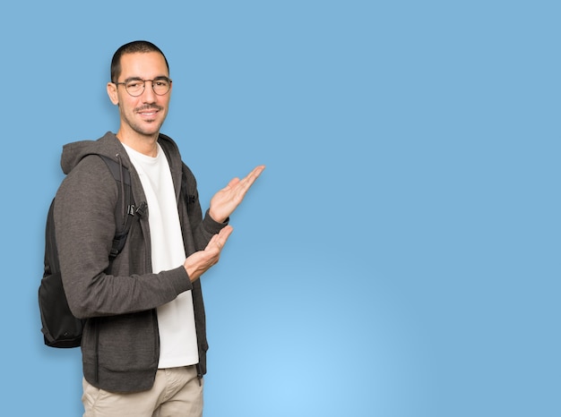 Friendly student making a gesture of welcome