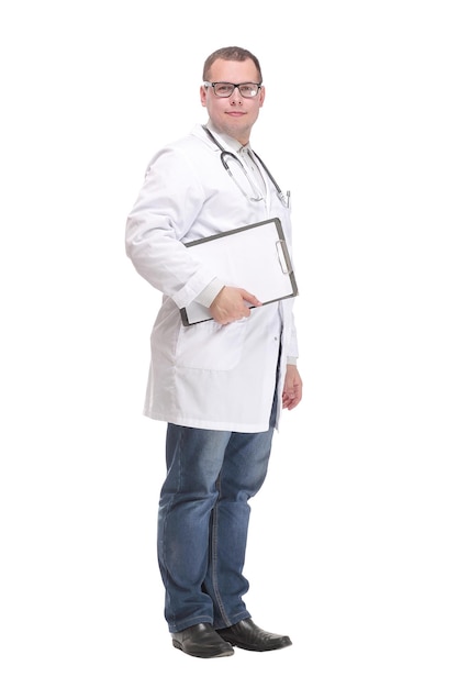 Friendly young doctor holding and pointing to notepad