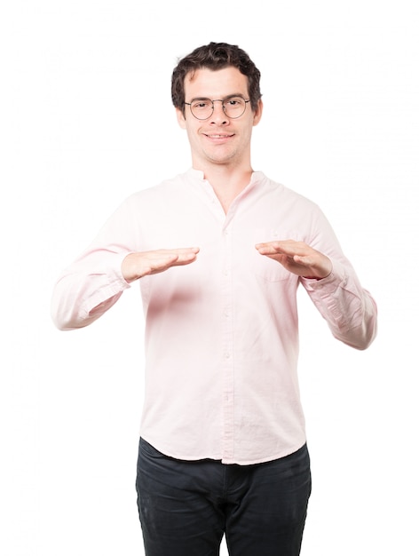 Friendly young man doing a gesture of keep calm