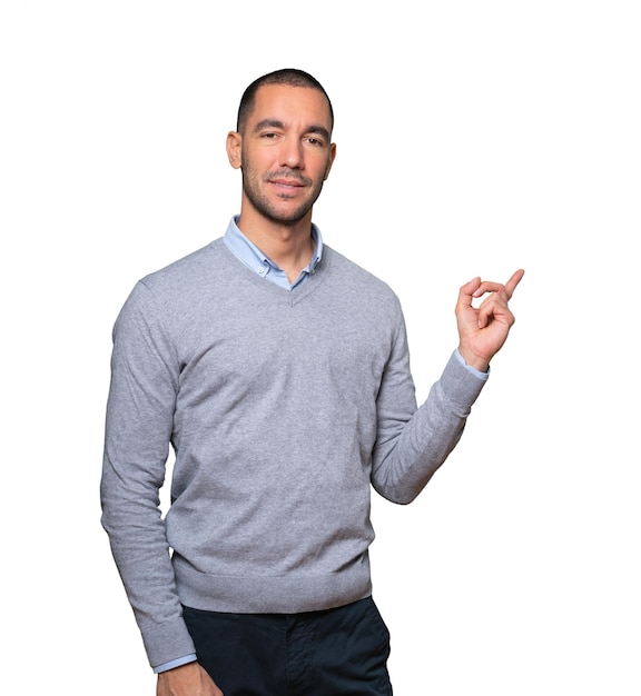 Friendly young man making a gesture of welcome