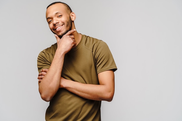 Friendly young man wearing a green t-shirt