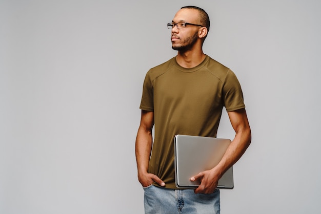 Friendly young man wearing a green t-shirt