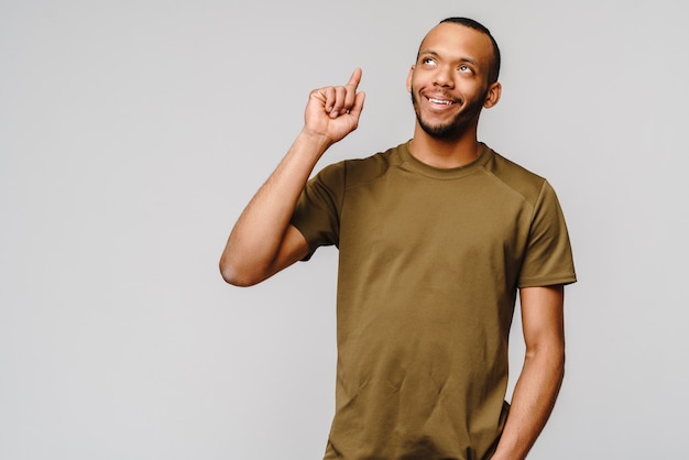 Friendly young man wearing a green t-shirt