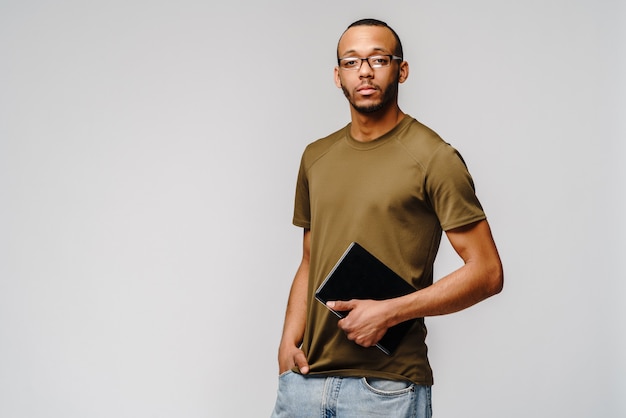 Friendly young man wearing a green t-shirt