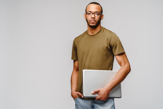 Friendly young man wearing a green t-shirt