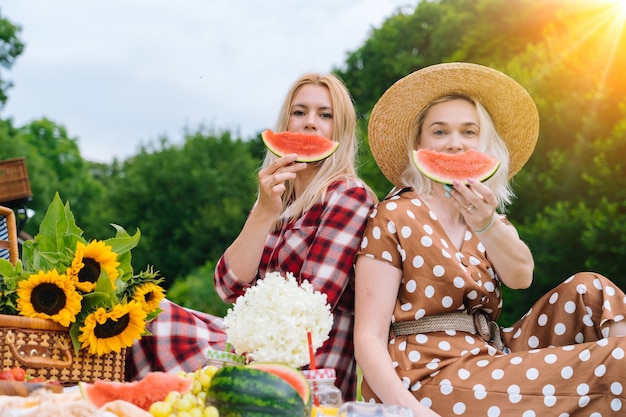 Friends are making picnic outdoor 