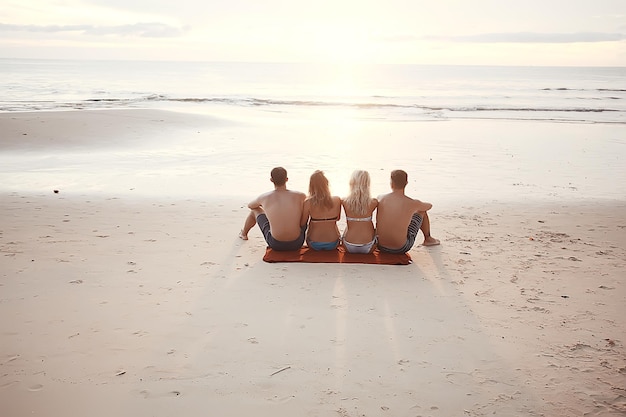 Friends on the beach summer by the sea / cheerful company of\
young friends, summer view