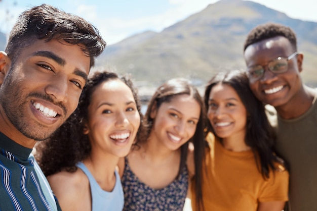 Friends become our chosen family. Portrait of a group of young friends hanging out together outdoors.