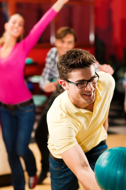 Friends bowling having fun