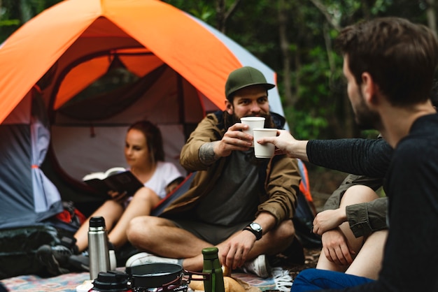 Friends camping in the forest together