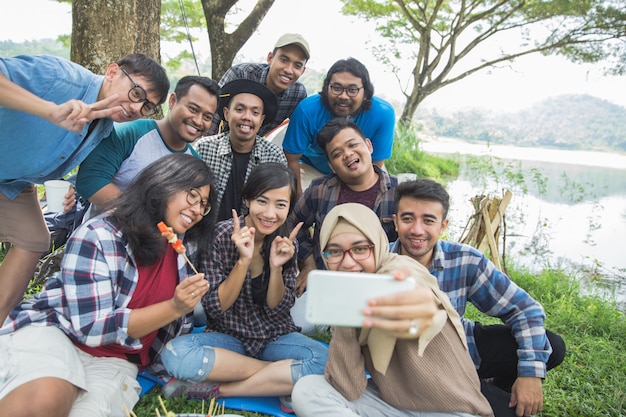 Friends camping selfie together