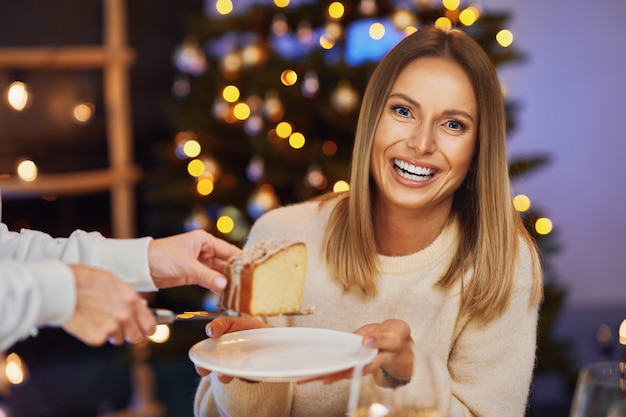 Friends celebrating christmas party holding wine. High quality photo