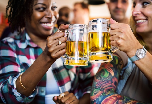 Friends cheering sport at bar together