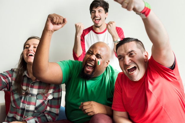 Friends cheering world cup with painted flag