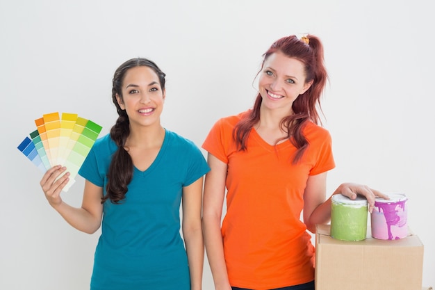 Friends choosing color for painting a room