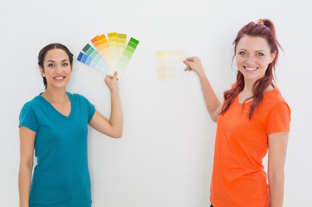 Friends choosing color for painting a room