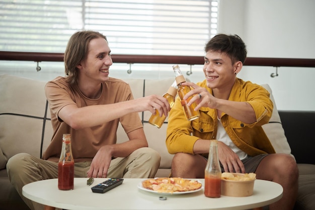 Friends Clinking Beer Bottles