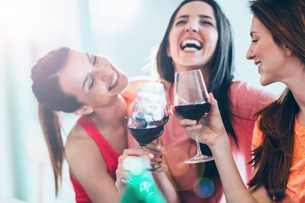 Friends drinking wine in restaurant