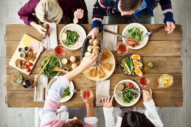 Friends Eating at Dinner Table