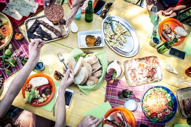 Friends eating at picnic