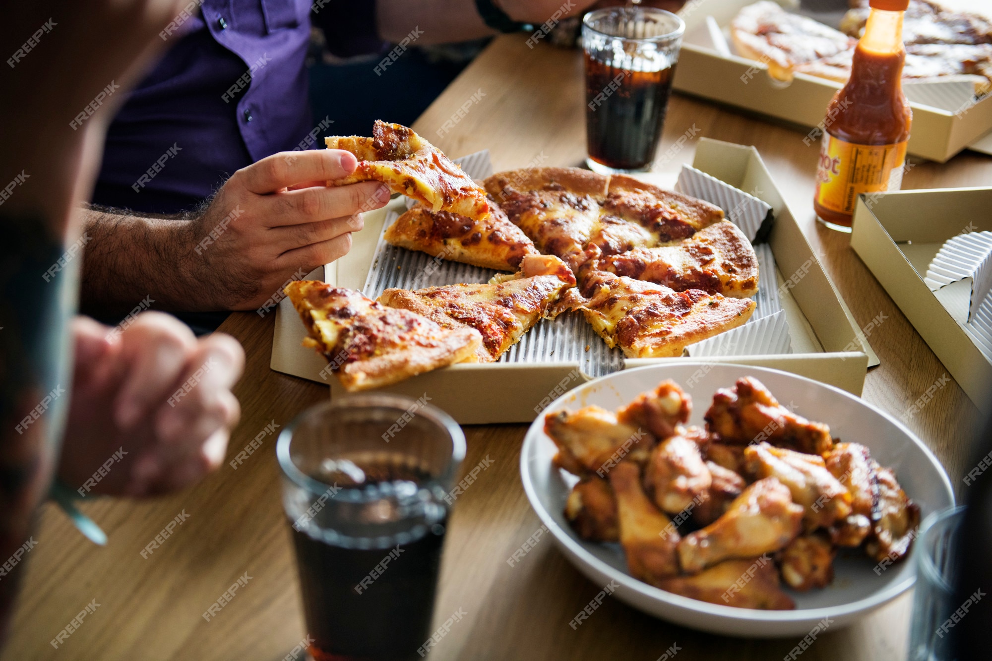 Group Of Friends Eating Pizza Together At Home Stock Photo, Picture and  Royalty Free Image. Image 56950664.