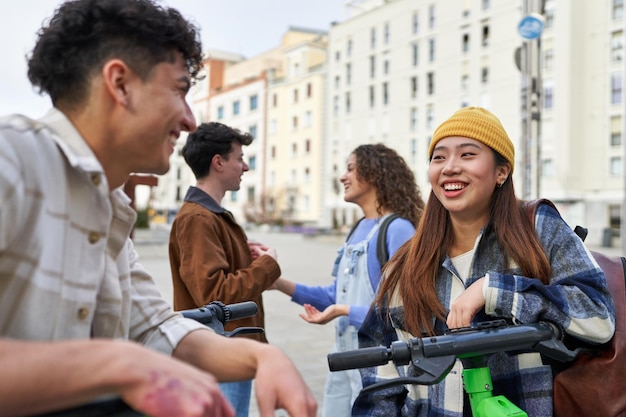 Friends on electric skates pointing ahead for adventure