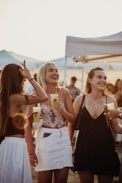 Friends enjoying at a summer music festival.