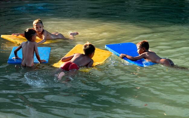 Photo friends floating on water at water park