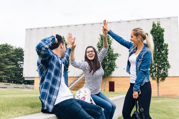 Friends giving high five