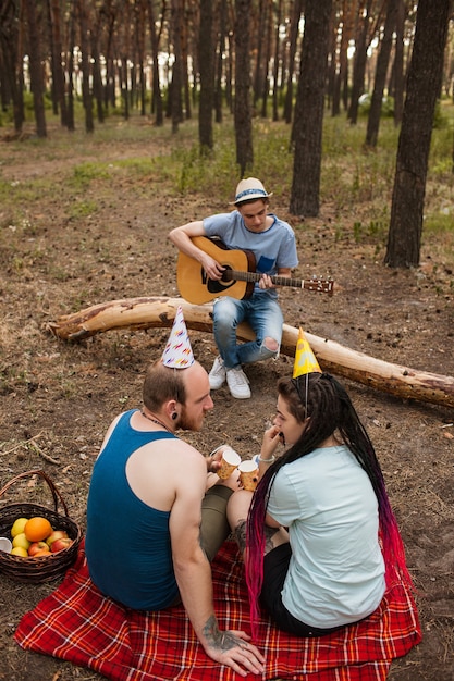 Friends guitar music picnic party nature concept. Traveler lifestyle. Hiking happy moments.