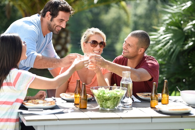 Friends having lunch outside on a sunny day