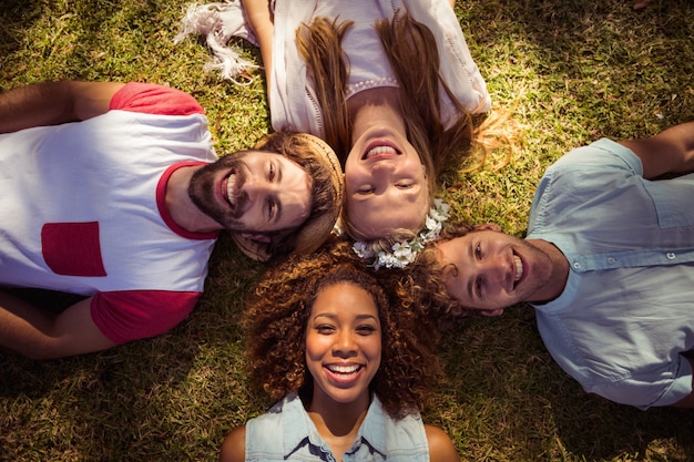 Friends lying on grass