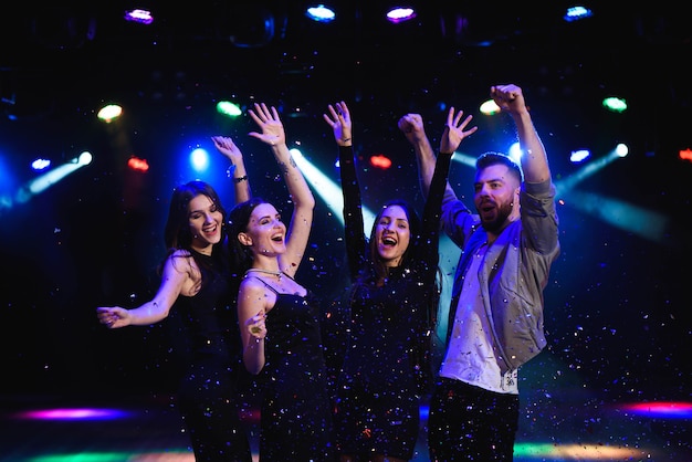 friends making having fun among confetti