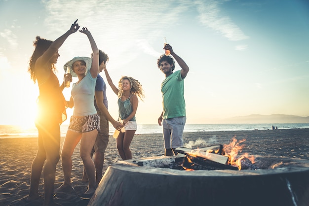 Friends partying on the beach