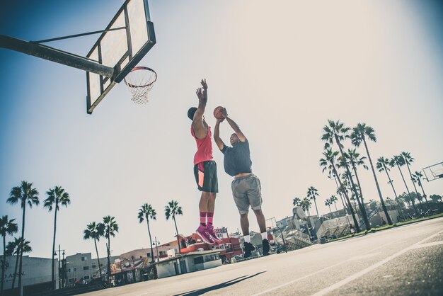 Friends playing basketball