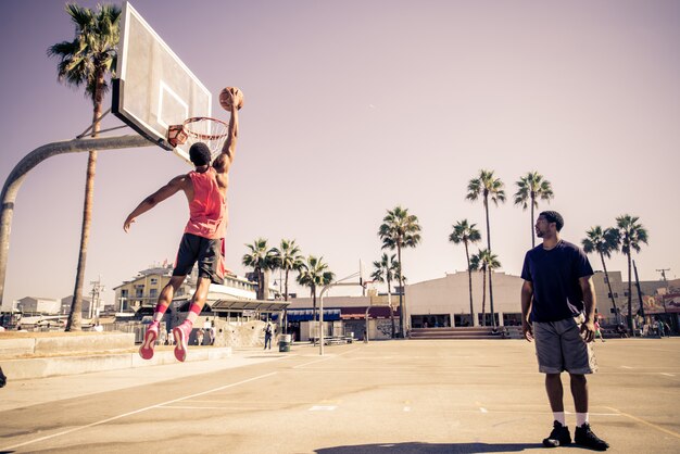 Friends playing basketball