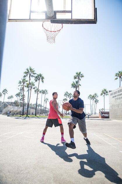 Friends playing basketball