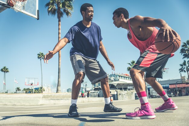 Friends playing basketball