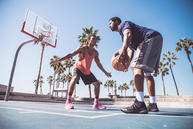 Friends playing basketball